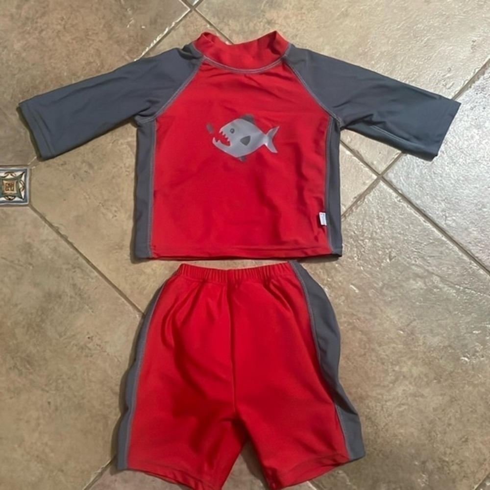 I play boys shark swim shirts and shirt size 12 months
